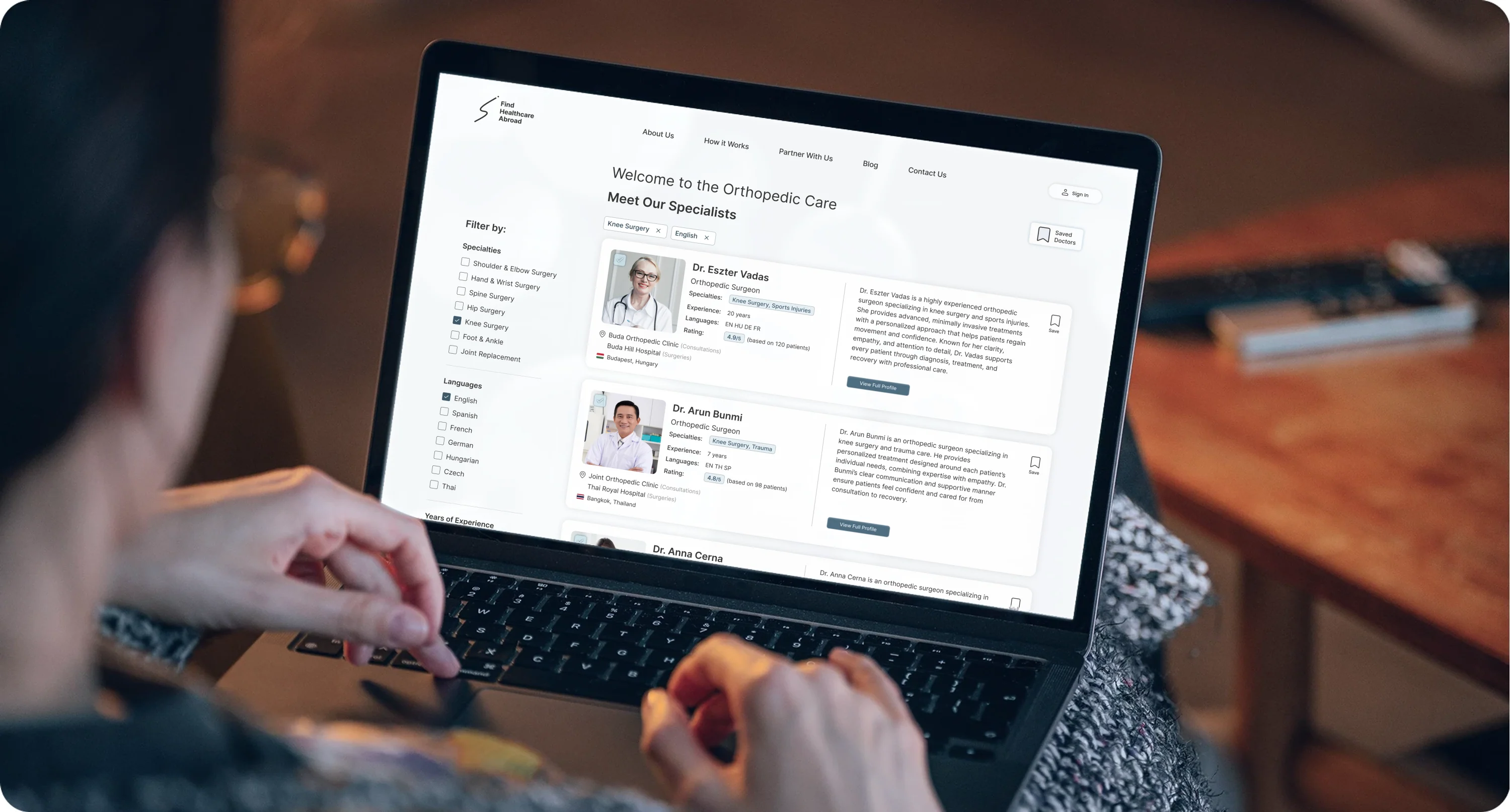 A person browsing the Find Healthcare Abroad specialist search on a laptop